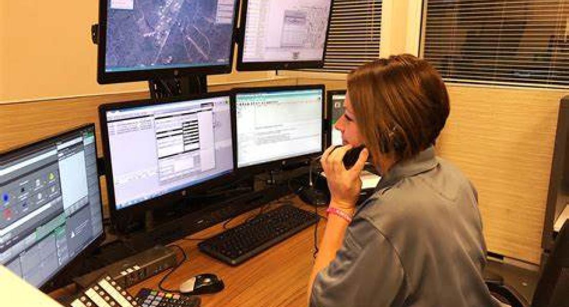 Dispatcher seated at call center desk